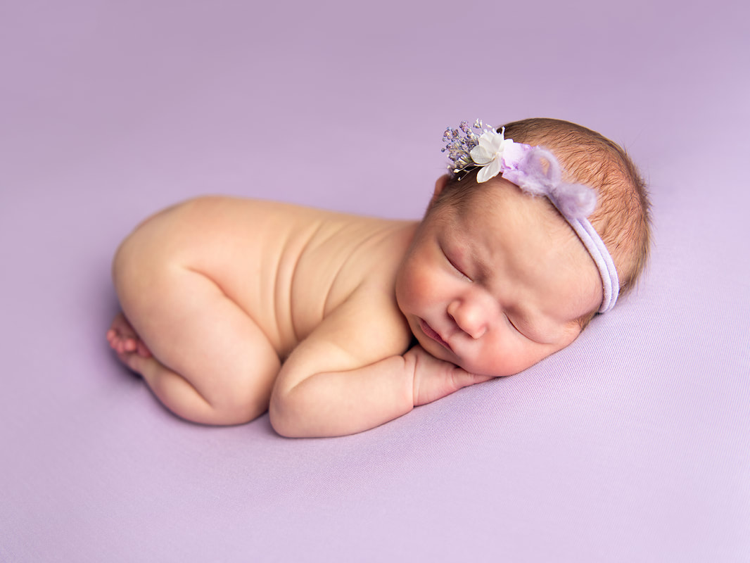 Picture of new baby just born and posed by professional trained and insured photographer in Sheffield