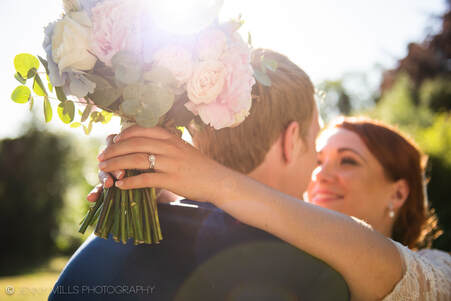 Wedding photography at Makeney Hall Hotel, Belper, Derbyshire. Bride and Groom Portrait with Flowers. 